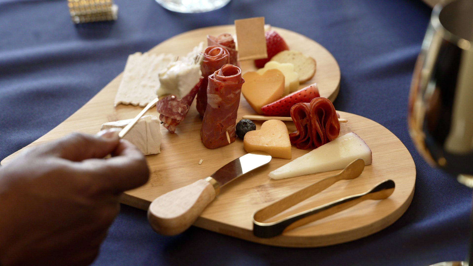 Heart-shaped charcuterie board with meats and cheeses